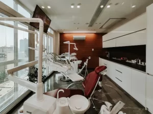 private dental room, with a screen and comfortable seating