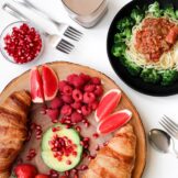 A table with food on top, brioches, spaghetti, avocado, broccoli. TO be cautious of when having dental bridges